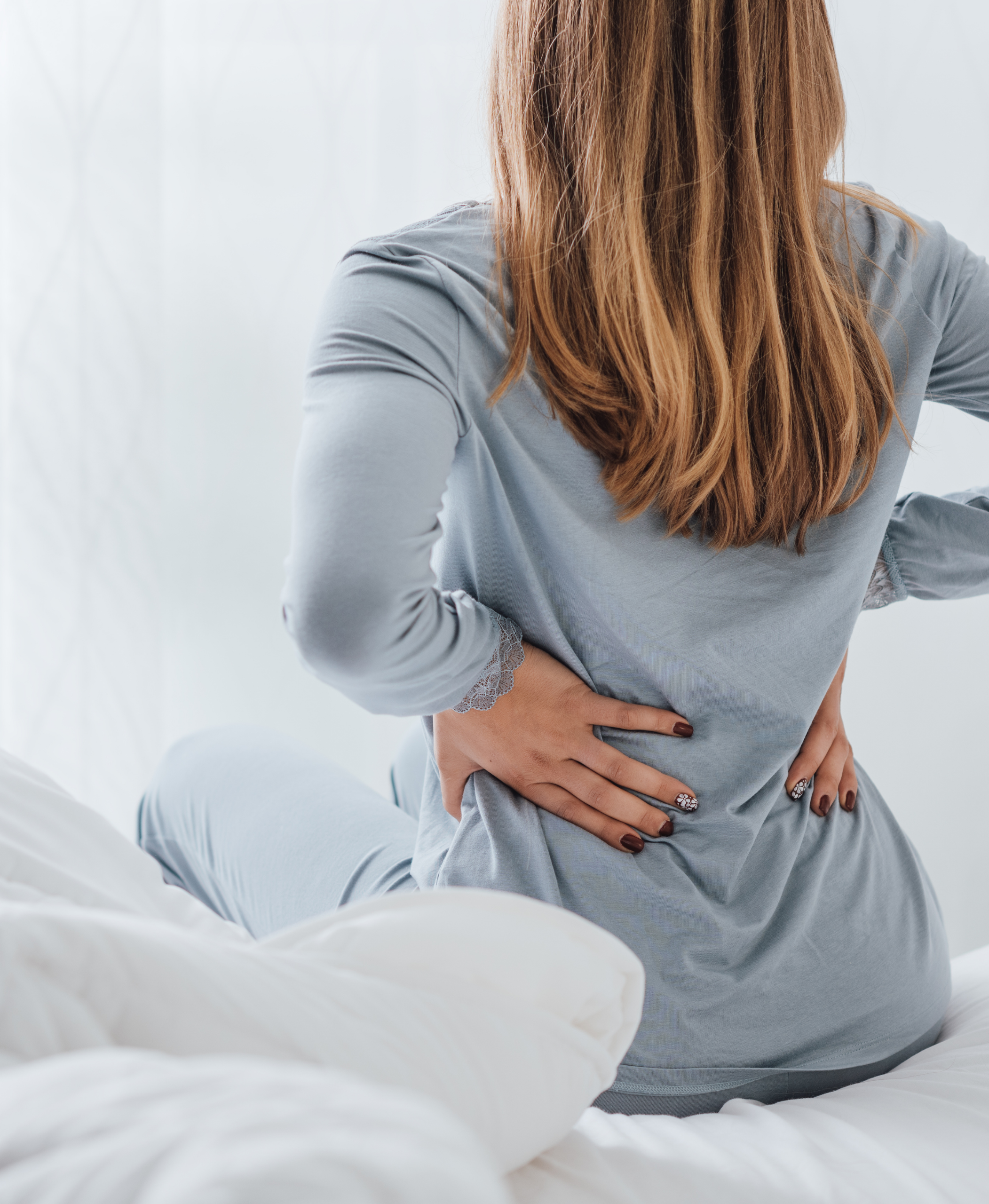 The Link Between Large Breasts and Back Pain: How Gigantomastia Can Bring Relief